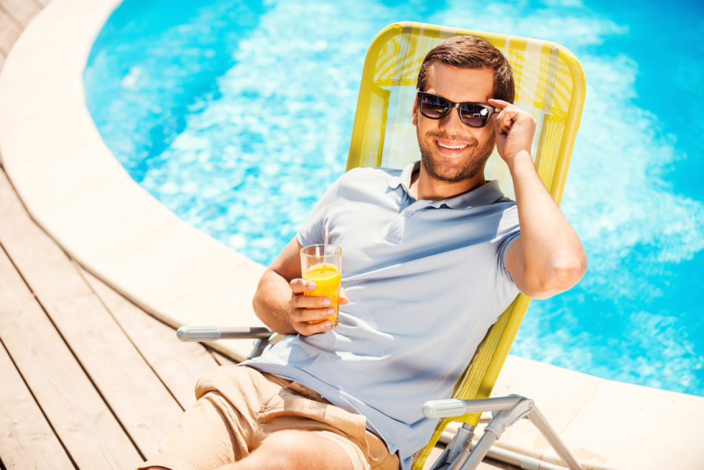 Man with Sunglasses at a Swimming Pool